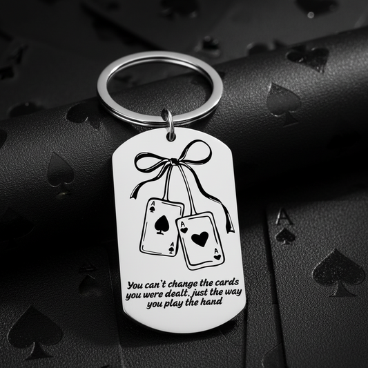 Keychain with playing card design and motivational quote on a white background