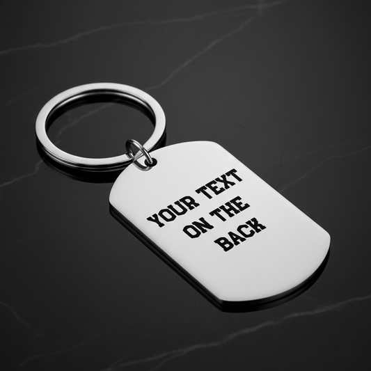 Reverse of personalised stainless steel cricket dog tag keyring
showing laser engraved personal message