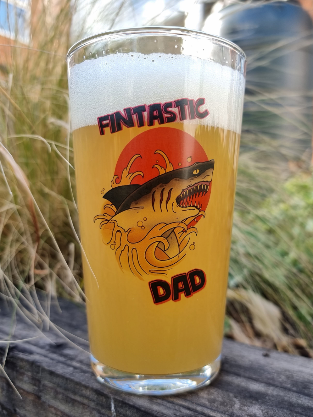 Laser engraved pint glass featuring a shark jumping out of beer with the text “Fintastic Dad” – funny Father’s Day beer gift for dads