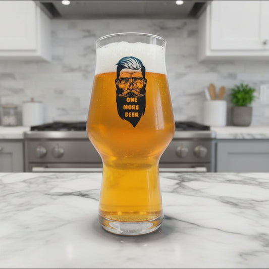 One More Beer custom printed personalised beer glass with bold
hipster skull and beard design on a tall stemless beer glass in a kitchen setting