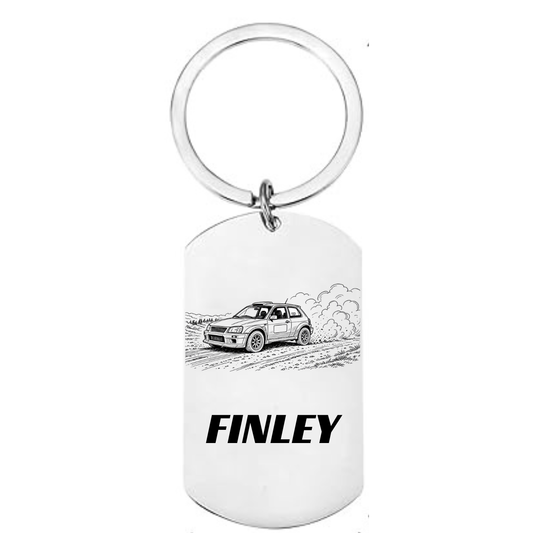 Personalised rally car laser engraved stainless steel dog tag
keyring with classic hatchback dirt stage illustration and
personalised name on white background