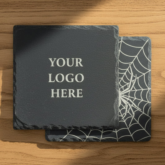 A laser-engraved slate coaster with a custom logo