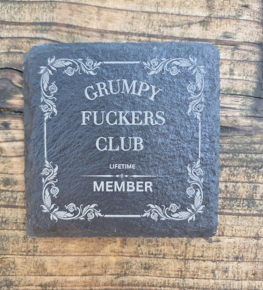 laser engraved slate coaster with “Grumpy Fuckers Club” text and floral border – funny sarcastic drink coaster gift for grumpy people, rustic home or office décor