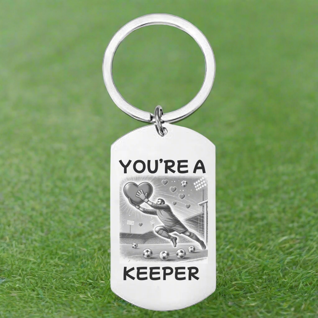 Personalised “You’re a Keeper” Football Keyring – Stainless Steel with Goalkeeper & Heart Design
Celebrate love and football with this fun and meaningful personalised stainless steel keyring, featuring a goalkeeper diving to catch a heart and the playful text “You’re a Keeper.” Whether you're shopping for your football-loving partner or a sporty Valentine’s Day gift, this unique keepsake is a perfect way to show someone they’ve captured your heart.
Made from durable stainless steel, this keychain is desig
