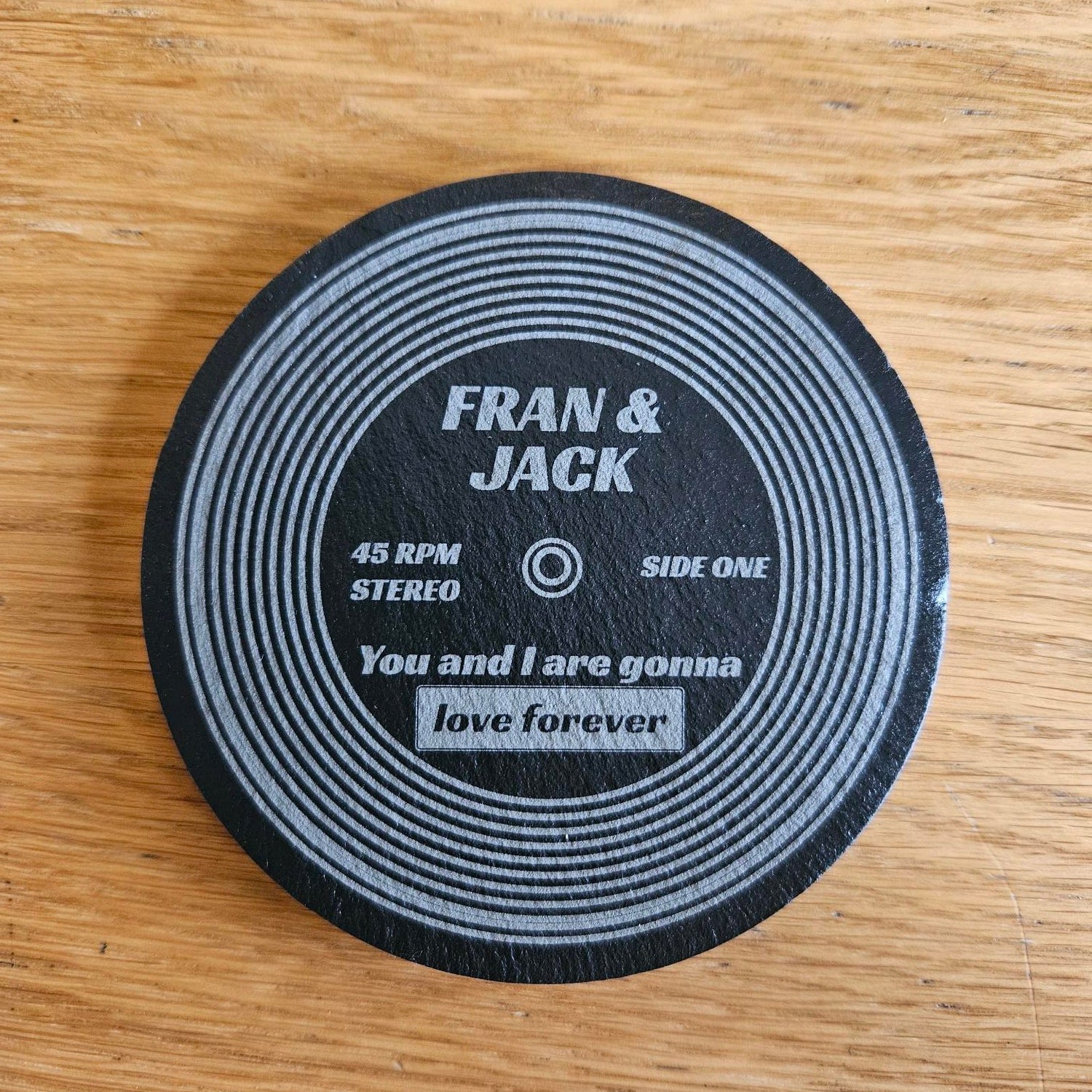 Personalised vinyl record coaster with Fran and Jack names custom song title laser engraved bamboo 45 RPM design
