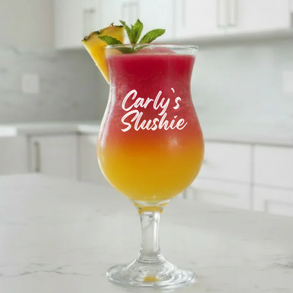 Personalised slushie glass engraved with "Carly's Slushie" filled with pink and yellow cocktail
