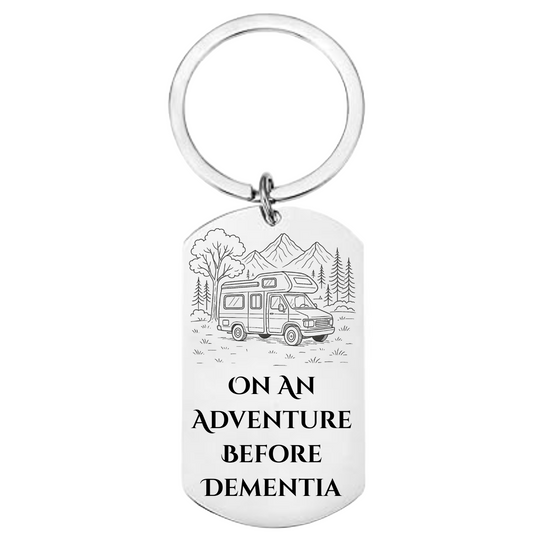 Stainless steel keyring with campervan engraving and text saying “On an Adventure Before Dementia”