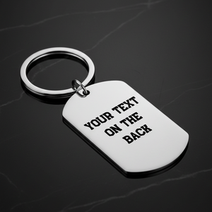 Reverse of personalised stainless steel cricket dog tag keyring 
showing laser engraved personal message