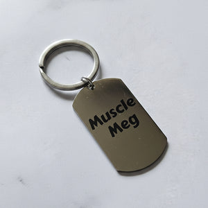 Keychain with 'Muscle Meg' personalised text on a grey background
