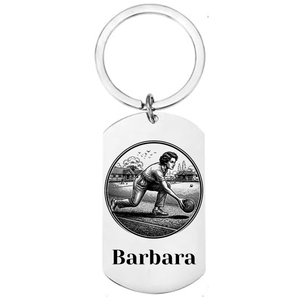 Personalised lawn bowls keyring laser engraved stainless steel dog tag with female bowls player delivery scene in circular medallion design and personalised name on white background