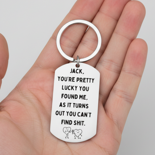Keychain with humorous text and cartoon characters on a white background