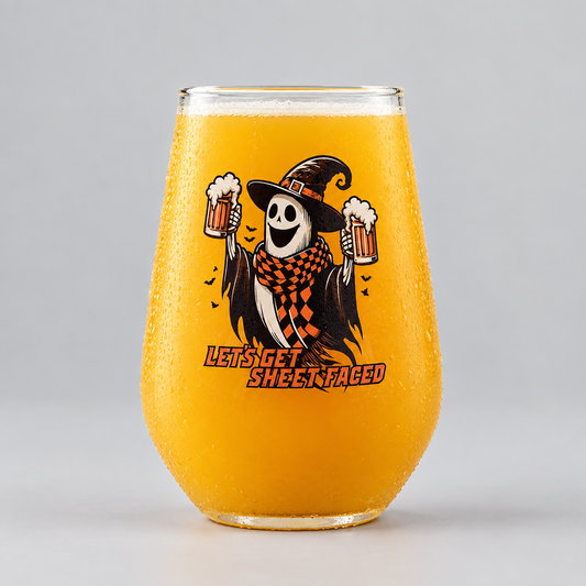 A stemless wine glass filled with orange beer, covered in condensation, featuring a cartoon witch holding beer mugs and the text 'LET'S GET SWEETED' on a light gray background.