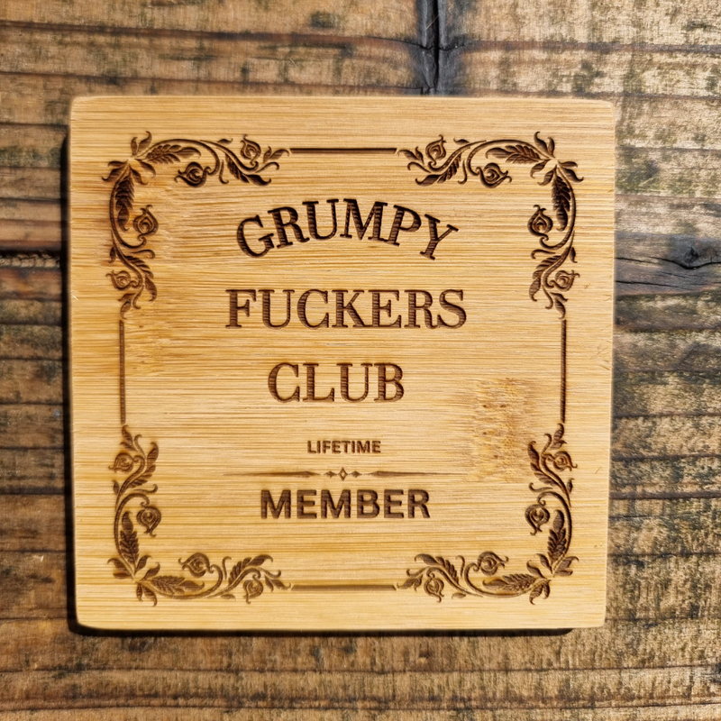 Engraved wooden sign reading “Grumpy F*ckers Club Lifetime Member” with decorative vintage border, laser engraved on natural wood plaque with rustic finish.