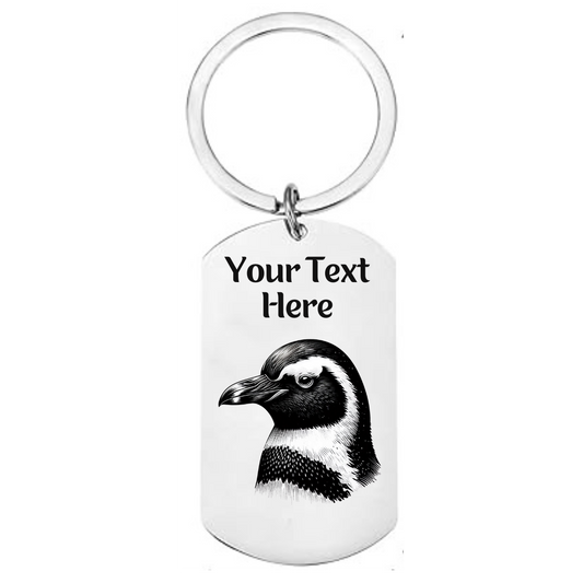 Keychain with penguin design and customizable text on a white background