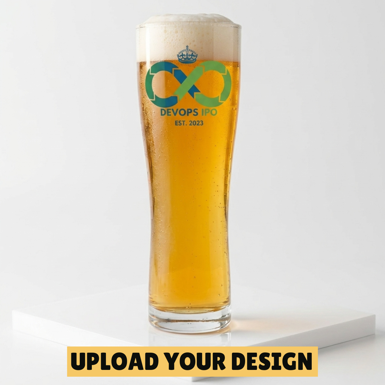 Personalised 568ml toughened Aspen pint glass with custom uploaded DevOps IPO logo design filled with golden beer on 