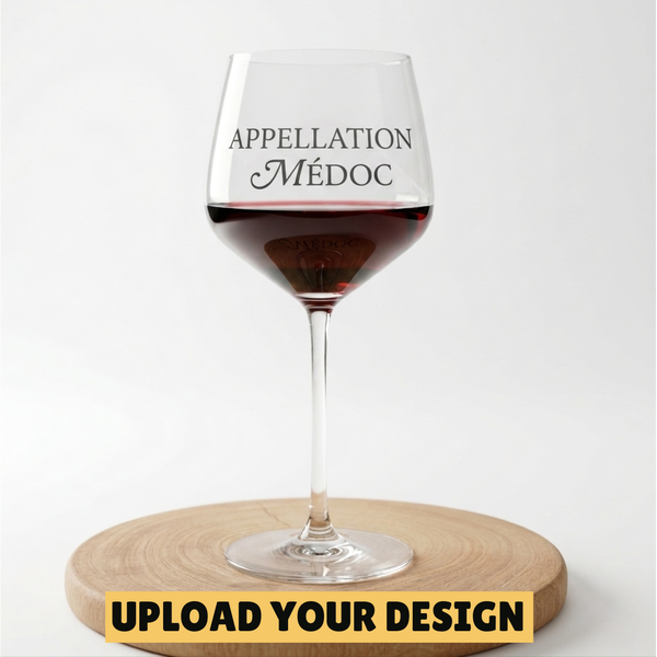 Personalised 650ml large stemmed wine glass with custom uploaded Appellation Medoc design filled with red wine on wooden board