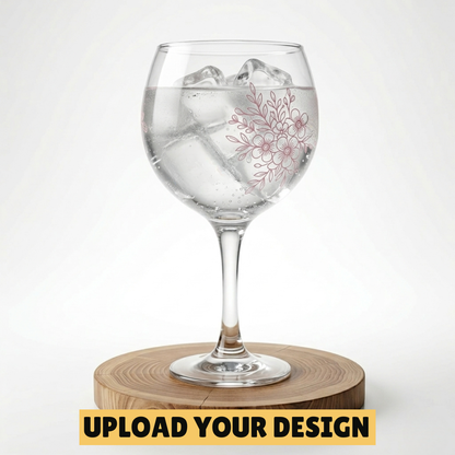 Personalised Copa balloon gin glass with custom uploaded floral design filled with ice and gin on wooden board, unique gift for her