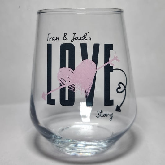 Personalised Love Story couples glass printed with names — bold LOVE design with gold heart and arrow by First Glass Designs UK