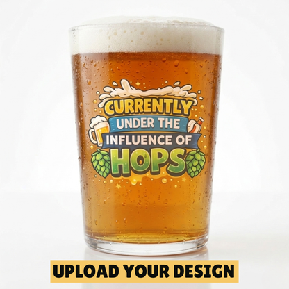 Personalised conical pint glass with custom uploaded Currently Under the Influence of Hops design filled with golden beer