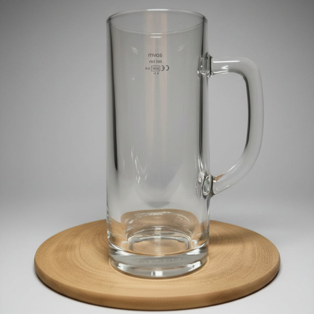 Plain glass pint stein with handle on wooden board — shown blank before custom design is applied, white brick background