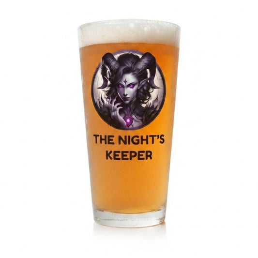 Personalised gothic fantasy pint glass custom printed with dark horned figure design displayed on a dark wood surface with atmospheric gothic setting