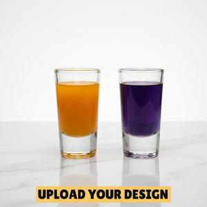 Personalised set of two 30ml shot glasses filled with orange and purple drinks on marble surface, unique custom printed party gift