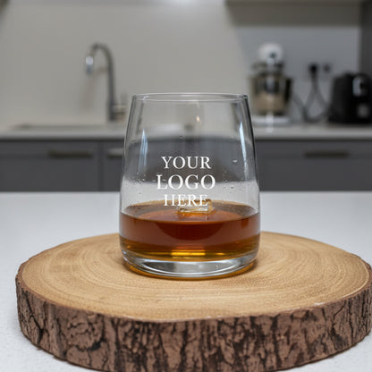 Personalised stemless whiskey glass with Celtic uploaded design filled with golden whiskey, unique birthday and Christmas gift for him