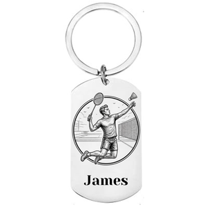 Personalised badminton keyring laser engraved stainless steel dog tag with male player jump smash circular medallion design and personalised name on white background