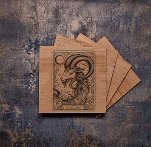 Personalised bamboo coaster engraved with the Capricorn zodiac sign, featuring its goat symbol and constellation, natural wood texture, ideal for horoscope enthusiasts or astrology décor.
