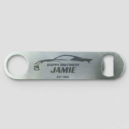 Personalised stainless steel bar blade bottle opener laser engraved with name, birth year and sports car silhouette design
