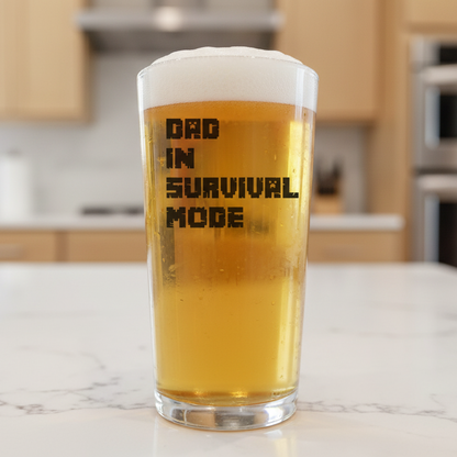 Ink-printed pint beer glass with the text “Dad in Survival Mode” – funny dishwasher-safe gift for gamer dads


