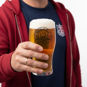 Dad holding a pint glass featuring a football dad design printed in black