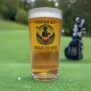Pint glass custom printed with golfer silhouette, heart-shaped golf ball and You're My Hole in One text
