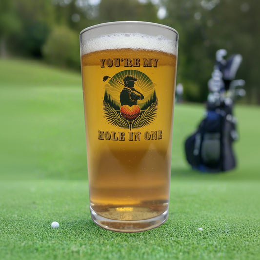 Pint glass custom printed with golfer silhouette, heart-shaped golf ball and You're My Hole in One text