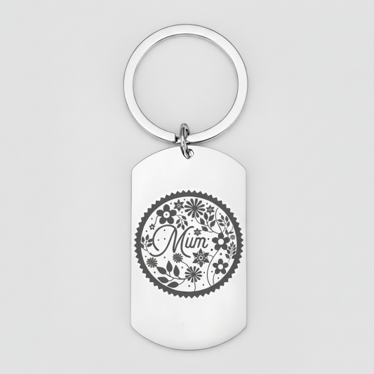 Stainless steel mum keyring laser engraved with a floral wreath design around the word Mum