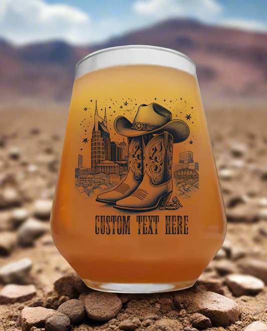 Line art illustration of a classic cowboy hat and boots in the foreground, with the Nashville skyline in the background, styled in a rustic Western theme. Perfect for country music lovers and Nashville enthusiasts