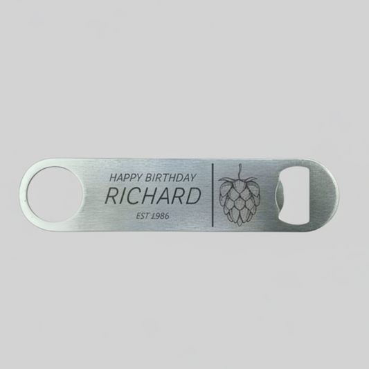 Personalised stainless steel bar blade bottle opener laser engraved with name, birth year and hop cone design