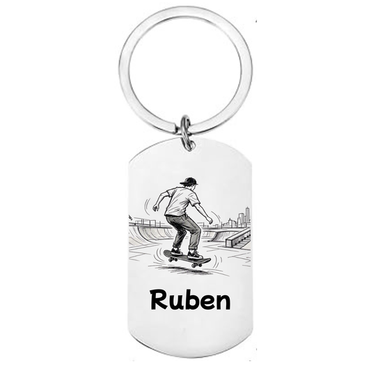 Personalised skateboarding laser engraved stainless steel dog tag keyring with urban skate park scene and personalised name on white background
