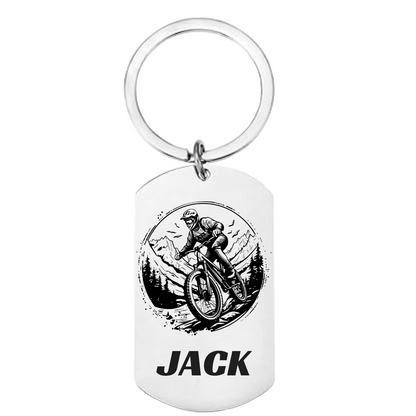 Keychain with a cyclist design and custom text on a white background